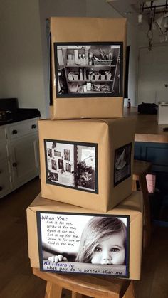 three cardboard boxes stacked on top of each other with pictures and words in the middle