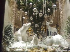 a christmas display in a store window with polar bears