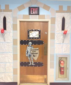 the door to an exit is decorated with paper machs and cardboard cutout figures