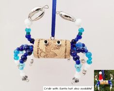 an ornament made out of wine corks with beads and charms hanging from it