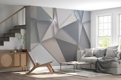 a living room scene with focus on the sofa and wallpaper that looks like an abstract design