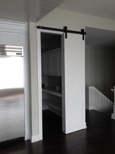 an empty room with a sliding door in it