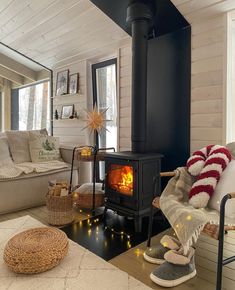 a living room with a fire in the fireplace