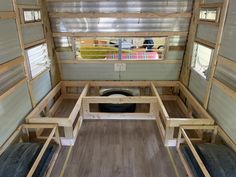 the inside of a tiny house with wood flooring