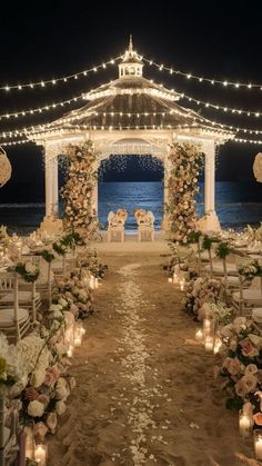 an outdoor wedding setup with candles and flowers