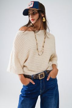 The Boat Neck Chunky Rib Sweater in Cream is the epitome of cozy elegance, perfect for embracing the crisp fall weather in style. Crafted from a luxurious blend of 70% viscose and 30% polyamide, this sweater offers a soft, fluffy texture that feels as comforting as it looks. The chunky rib knit adds a touch of rustic charm, making it an ideal choice for layering.  Featuring a flattering boat neckline and 3/4 length sleeves, this sweater exudes a relaxed yet refined vibe. The regular fit ensures comfort while still providing a polished silhouette, making it versatile enough to pair with anything from your favorite jeans to a chic midi skirt. Whether you're dressing it up for a day out or keeping it casual for a cozy night in, this sweater adds a classic touch to any fall outfit.  The model, Boat Neck Sweater, Rib Sweater, Color Crema, Boho Fabric, Boatneck Sweater, Boat Neckline, Estilo Boho, The Boat, Style Boho