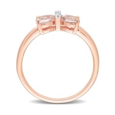 two stone engagement ring in rose gold with diamonds on the sides and an oval band