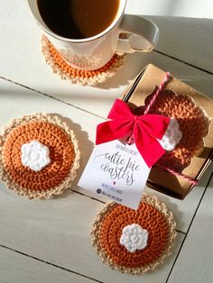 three crocheted coasters and a cup of coffee