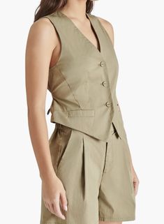 Front button closure Front welt pockets Adjustable back half belt Lined Material: 63% cotton, 34% nylon, 3% elastane Hand wash, dry flat Olive Vest, Ugg Style, Rollerball Perfume, Beauty Sale, Short Rompers, Vest Top, Dress Romper, Girls Accessories, Welt Pockets