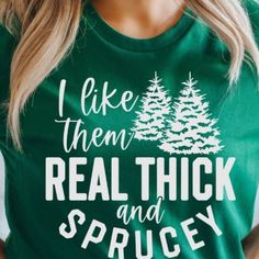 a woman wearing a green shirt that says i like them real thick and sprucey