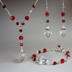 Vintage-look 3 piece jewellery set in festive shades of red made with Swarovski crystals, glass crystals and rhinestones. Perfect for any occasion, weddings and parties or as a gift. Set contains drop necklace with delicate silver colour plated chain, bracelet and a pair of long drop earrings.   Please contact me if you'd like different size or colour, this jewellery can be customized!   Materials used:  Swarovski crystals, clear (4 mm), glass rondelle crystals, clear (12 mm), glass round crysta Long Earrings Wedding, Costume Jewelry Sets, Diy Jewelry Unique, Crystal Jewelry Sets, Bridesmaid Gifts Jewelry, Diy Bracelet Designs, Crystal Bead Necklace, Swarovski Crystal Necklace, Silver Jewellery Sets