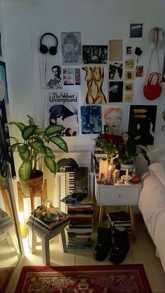 a living room filled with furniture and lots of pictures on the wall next to a bed