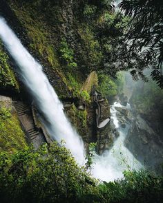 a waterfall with water cascading down it's sides