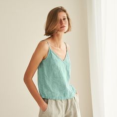 "You can never have too many all-season friendly tops. FEATURES: * relaxed fit * spaghetti straps * wrinkly fabric * top length is 50 cm / ~20\" (size S) * 100 % natural, certified linen fabric * dyed and washed in small batches * natural cotton yarns * handmade at a small studio in Europe COLORS: Dyed and washed in small batches, so the color will be unique and superb quality to each piece. Please check the color options on the side menu. SIZE GUIDE / BODY MEASUREMENTS: XS Bust 28- 31\" (72- 80 Summer Cotton V-neck Top With Relaxed Fit, Relaxed Fit V-neck Tank Top For Spring, Spring V-neck Camisole With Adjustable Straps, Summer V-neck Camisole For Vacation, Cotton V-neck Camisole With Adjustable Straps, Summer Cotton V-neck Camisole, Spring Summer Camisole With Spaghetti Straps, Summer Camisole With Spaghetti Straps For Brunch, Vacation Tank Top With Spaghetti Straps