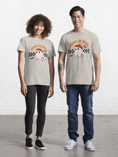 two people standing next to each other wearing t - shirts