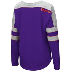 As a devout Clemson Tigers fan, you're always on the hunt for new team gear. Now, you can merge your comfy style and passion for the Clemson Tigers into one by ordering this amazing Trey Dolman T-shirt from Colosseum. Perfect to slip on when you're relaxing, this long sleeve top is made from soft material and boasts bold team graphics on the front. With just one look, people will be able to see that the Clemson Tigers hold a special place in your heart. Back neck taping Brand: Colosseum Contrast Collegiate Fall Fan Gear Tops, Team-colored Fan Apparel Tops For Fall, Fall School Spirit Team-colored Tops, Purple Fan Apparel Top With Letter Print, Collegiate Purple Cotton Tops, Collegiate Purple Top For Game Day, Purple Collegiate Cotton Tops, Collegiate Purple Tops With Letter Print, Purple Collegiate Tops For Sports Events