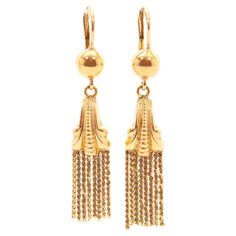 A pair of Art Deco tassel dangle earrings created in 18 karat yellow gold. The earrings are beautifully detailed with a scrolling design on the front and back side. The gold is embellished with vertical ribbed motifs in the center. Below the top the tassels are row set and swing freely back and forth. The earrings closes with a secure lever-back closure. The earrings are in very good condition and of high quality. They measure 50 mm in length and have a nice heavy weight of 7 grams. Hallmarks ar Gold Cushions, Diamond Dangle Earrings, Crystal Dangle Earrings, Earring Crafts, Sea Pearls, Gold Earrings Dangle, Jewelry Earrings Dangle, Gold Earrings, Art Nouveau