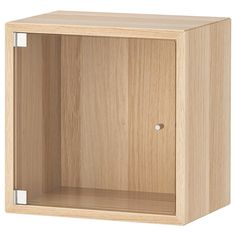 an empty wooden cabinet with one door open