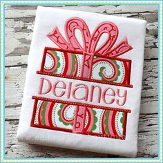 a red and green gift box with the words delaney on it