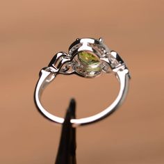 It is real natural peridot ring, the round cut peridot is about 7mm*7mm.weight about 1.41 carats. The basic metal is sterling silver and plated with rhodium. To change the metal to a solid gold (white/rose) or platinum is also available, please ask for a quotation if you want. You can also go to my shop Home for more elegant rings: https://www.etsy.com/shop/godjewelry?ref=hdr_shop_menu Ruby is the birthstone of August, it will be a great gift for your lover! More peridot rings: https://www.etsy. Fine Jewelry Diamond Ring With Peridot, Peridot Birthstone Ring For May, Peridot Gemstone Ring, Fine Jewelry Peridot Ring, Peridot Ring With Round Cut For May Birthstone, Round Cut Peridot Ring For May Birthstone, Peridot Gemstone Birthstone Ring, Round Peridot Birthstone Ring For Anniversary, Peridot Birthstone Ring With Accent Stones