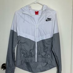 Nike Light Women’s Windbreaker - Brand New Without Tags It’s Just Been Sitting In My Closet But I’ve Never Worn It. Has Zipper Pockets And Mesh Inner Lining As Shown In Images. Trendy White Windbreaker With Pockets, Nike White Outerwear With Pockets, White Nike Outerwear With Pockets, White Nike Windbreaker For Fall, Nike Gray Casual Windbreaker, Casual Gray Nike Windbreaker, Casual White Long Sleeve Windbreaker, Trendy White Long Sleeve Windbreaker, Nike White Spring Outerwear