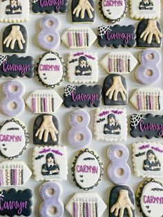 decorated cookies are arranged in the shape of numbers and names for children's birthdays