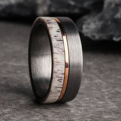 a wedding ring with an antler wood inlay