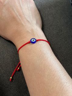 "Red string bracelets made of durable nylon cord, resin evil eye. Nickel free, lead free, no other harmful chemical composition lightweight and waterproof.  Adjustable, The max length is 10\", Adjust woven rope allows to create the perfect size for any wrist. Suitable size for Unisex Adult, Teens, Little girls, boys. This cute bracelet will be your amulet, the red strings are used for protection and luck and the evil eye works as a powerful negative energy drifter." Adjustable Red Evil Eye Friendship Bracelets, Casual Adjustable Evil Eye Bracelet As Gift, Red Evil Eye Friendship Bracelet, Flexible Red Jewelry For Gift, Red Evil Eye Bracelet With Adjustable Cord, Adjustable Casual Evil Eye Jewelry, Adjustable Evil Eye Casual Jewelry, Casual Adjustable Evil Eye Jewelry, Adjustable Red Evil Eye Jewelry