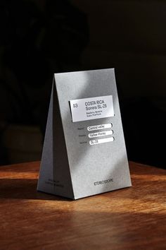 a silver paper bag sitting on top of a wooden table