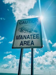 there is a sign that says manatee area