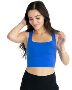 Look sleek yet feel effortless in this clean line, royal blue tank. Crafted from the softest seamless material, it's designed to offer a comfortable and flattering fit for all shapes and sizes. Get the perfect look with its subtle square neckline, sure to keep you looking and feeling your best. One size. Details: One Size 92% Nylon, 8% Spandex Blue Medium Support Tank Top, Blue Fitted Tank Top With Square Neck, Fitted Blue Square Neck Tank Top, Blue Stretch Seamless Tank Top, Blue Stretch Tank Top With Seamless Construction, Fitted Blue Tank Top With Square Neck, Stretch Blue Tank Top With Seamless Construction, Square Neck Tank Top With Built-in Bra, Stretch Square Neck Tank Top With Built-in Bra