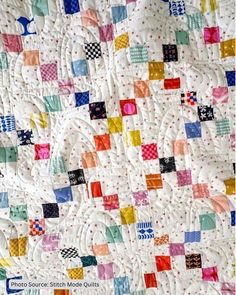 the quilt is made with different colored squares