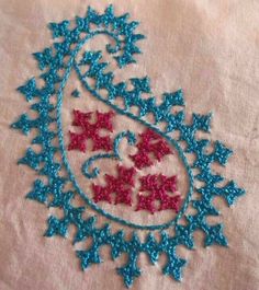 an embroidered piece with red, white and blue stars on it