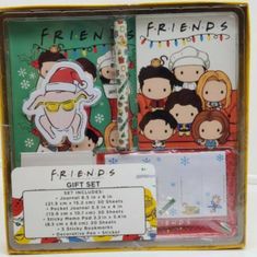 an open box with some stickers on the front and side of it, including a christmas