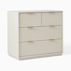 a white dresser with three drawers and gold pulls on the bottom drawer, against a white background