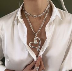 Elevate your style with our exquisite Oversized Heart Swarovski Pendant by AnAngelsHug. Welcome! 📌Please Kindly Note: The listing is for only one necklace!! 📌It is made of steel chain & Zamak, which have been immersed in 999o sterling silver twice, and an original Swarovski crystal. 📌It has a good weight on it! 📌You can experiment and style this piece in multiple ways! 📌Many of our jewelry has been through an oxidation process. Therefore, some natural black marks may occur for a more obvious vintage-aged tone but oxidation naturally wears off over time. MEASUREMENTS: Necklace total length: 36'' (91,50cm) Heart pendant: 2.55'' (6,50cm) x 2.1'' (5,5cm) Chain width: 0.027'' (0,07cm)  Matching: 📌MADE TO ORDER! All jewelry can be adjusted to any size and custom-made for you!  There are no Heart Crystal Necklace, Swarovski Pendant, Heart Crystal, Swarovski Necklace, 50 Style, Double Chain, Gold Chain Necklace, Matching Bracelets, Chain Pendant