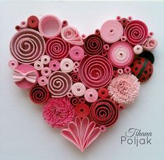 a heart made out of different types of buttons