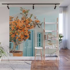 an image of a wall mural with orange flowers in the vase and blue shutters