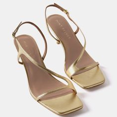 Gold leather sandals featuring a low heel, asymmetric sling-back strap with a gold-tone buckle fastening. Simple Gold Heels, Strappy Kitten Heels, Gold Kitten Heels, Vintage Heels, Gold Shoes, Mint Velvet, Gold Heels, Bar Mitzvah, Gold Leather