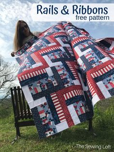 a woman is sitting on a bench with a quilt in the shape of an american flag