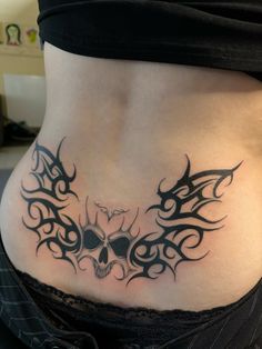 a woman with a tattoo on her stomach