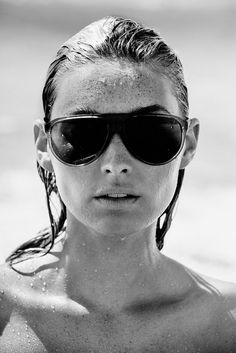 a woman wearing sunglasses in the water