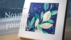 an image of a painting with the words negative painting on it and leaves in blue