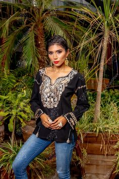 Embroidered Mexican design on the front and sleeves. Looking perfect will be easy with this top. It is elegant and made from Fine Mexican cotton. It is embroidered with a golden peacock inspired design and has knit details. This blouse is made in Mexico by Mexican artisans. More colors available here: Black/Multicolor: https://www.etsy.com/es/listing/1041676057/blusa-floral-con-wipiur-blusa-mexicana?ref=listings_manager_grid Traditional V-neck Tops With Intricate Embroidery, Traditional Festive Tops With Embroidered Sleeves, Traditional Tops With Embroidered Sleeves For Festive Season, Festive Tunic Top With Embroidered Neckline, Festive Long Sleeve Tops With Resham Embroidery, Resham Embroidery Tunic Top, Festive Long Sleeve Tops With Embroidered Sleeves, Bohemian Tops With Embroidered Sleeves For Festive Occasion, Festive Bohemian Top With Embroidered Sleeves