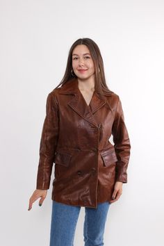 Hi! This is vintage from 80s brown leather jacket with double breasted front closure. This retro trench coat made of LEATHER with polyester lining. The model in the photo is 170 cm tall and is wearing a MEDIUM size coat. But, be careful, this is a vintage size, it is better to check the measurements below in the product description. Sleeve - 39cm / 15.35inch; ( armpit to end of sleeve); Width - 45cm / 17.71inch; Length - 73cm / 28.74inch. All measurements are taken seam to seam while lying flat. Retro Brown Double-breasted Outerwear, Vintage Long Leather Jacket For Fall, Fall Leather Jacket With Double-breasted Button, Vintage Brown Outerwear With Double Button Closure, Vintage Double-breasted Leather Jacket For Fall, Brown Double-breasted Leather Jacket For Work, Double-breasted Brown Leather Jacket For Work, Vintage Brown Double-breasted Pea Coat, Vintage Longline Leather Jacket