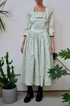 "Forties/Fifties Cool Minty Baroque Embossed Party Dress. Gathered Skirt. Metal Talon Side Zip. Cuffed Sleeves. Square Neck With Bib Collar Detail. Unlined. Tailored. No Content Label  No Size Tag- Fits S/M Excellent Vintage Condition - Small Marks Near Neckline Chest-34\" Waist-26\" Hips-Free Shoulder to Shoulder-15\" Sleeve Length-18\" Shoulder to Hem-50.5\" All Sales Are Final. We have taken the time to note all size measurements and the condition of each piece so please look over all the inf Spring Party Vintage Pleated Dress, Vintage Pleated Party Dresses, Vintage Pleated Dress For Party, Pleated Vintage Dress For Party, Elegant Vintage Dress With Full Skirt For Party, Elegant Full Skirt Dress For Vintage Events, 1950s Spring Vintage Event Dress, 1950s Style Dresses For Spring Vintage Events, 1950s Style Spring Cocktail Dresses