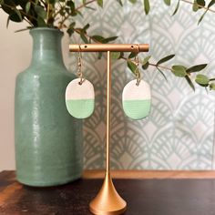 Discover the perfect blend of everyday elegance and bohemian chic with our handcrafted ceramic earrings. These pieces are made in small batches from porcelain clay, featuring hand-painted glazes and gold-plated or stainless steel hoops. Since all items are handmade, please expect slight variations from what is photographed.  Due to this handcrafted nature, no two pairs are exactly alike, making each piece as unique as the person wearing them. Lightweight and hypoallergenic, these earrings offer comfort and style, perfect for daily wear or special occasions. Packaged beautifully, they make an ideal gift or personal accessory to elevate any outfit with a touch of artisan charm. Handmade Minimalist Oval Earrings, Handmade Oval Minimalist Earrings, Minimalist Handmade Oval Earrings, Hand Painted Bohemian Earrings For Everyday, Minimalist Bohemian, Matte Green, Ceramic Earrings, Everyday Elegance, Ceramic Earring