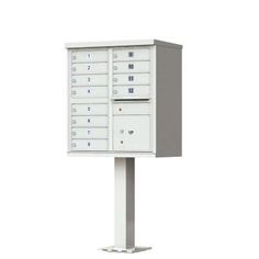 a white mailbox on a pole with four doors and five drawers in the middle