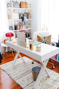 a white table sitting on top of a wooden floor