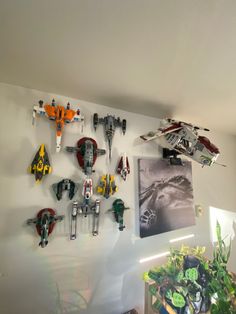 there are many legos on the wall in this room, and they look like spaceships